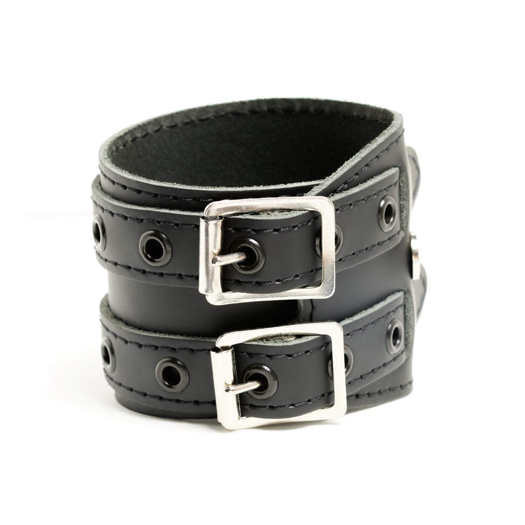 Addicted Excessories wraparound leather bracelet with black stitching and black eyelets, gothic boutique, handcrafted in Montreal Quebec Canada
