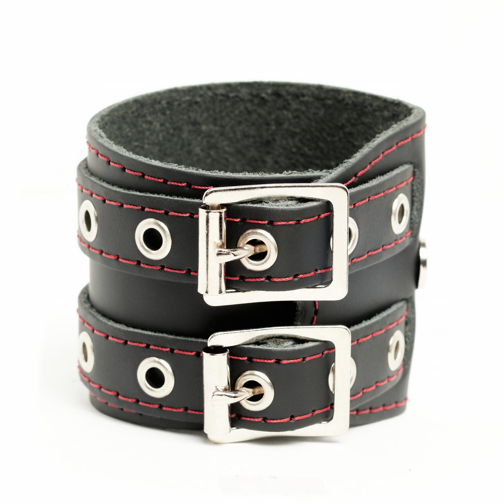 Addicted Excessories wraparound leather bracelet with red stitching and silver eyelets, gothic boutique, handcrafted in Montreal Quebec Canada
